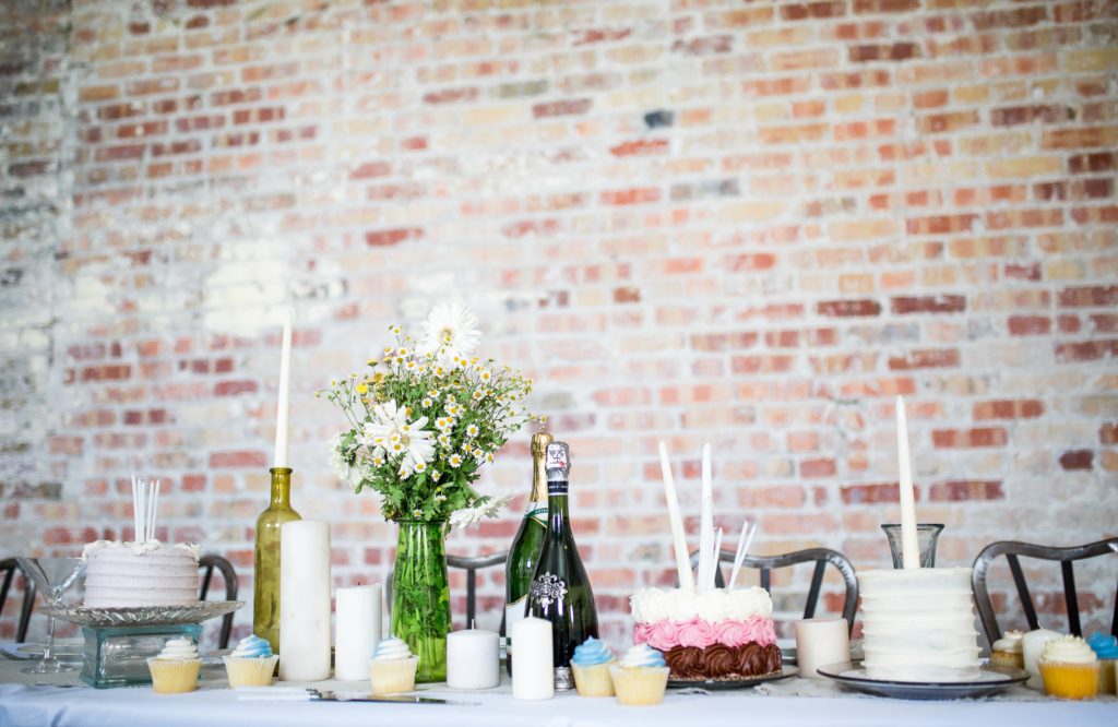 Table set with vase of flowers and candles.